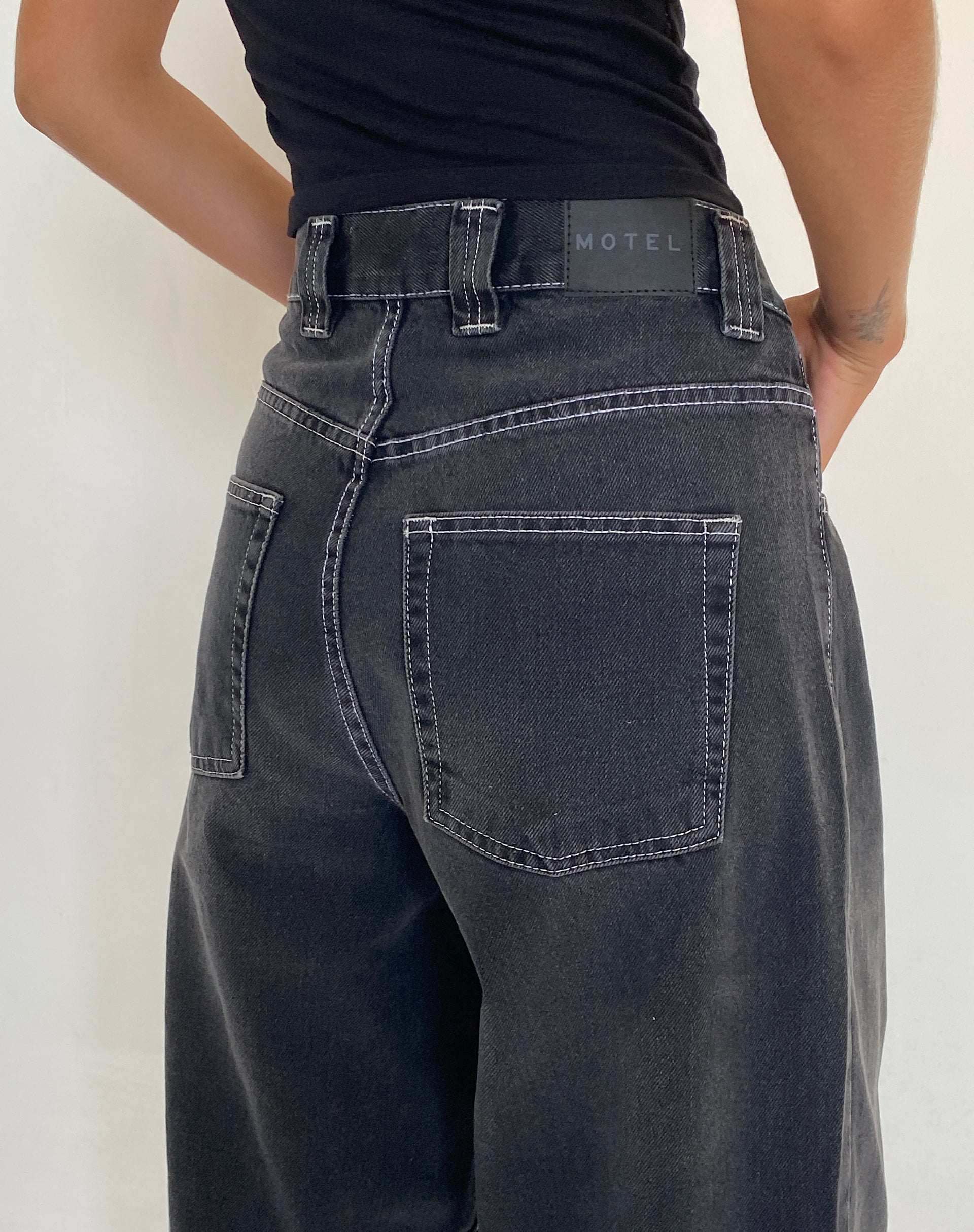 Black women's jeans with white orders stitching