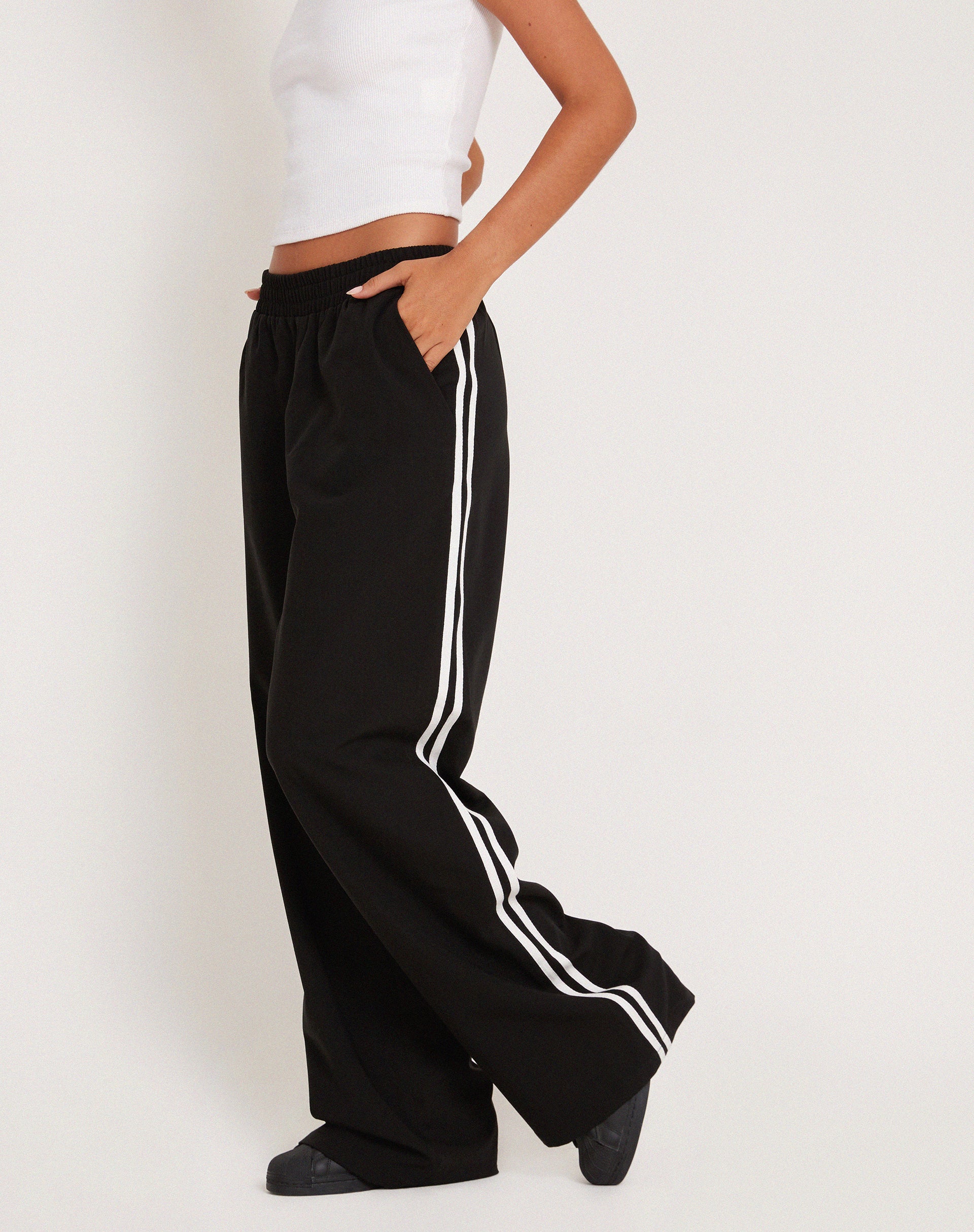 Black trousers with store stripe down side